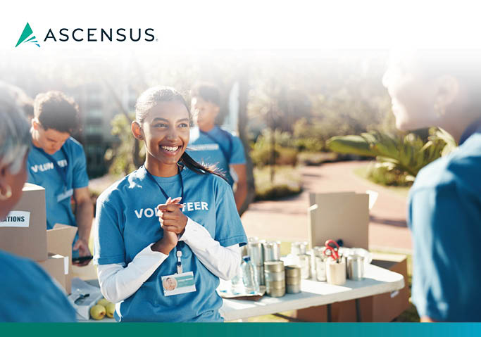 Ascensus logo above volunteers in blue 'Volunteer' shirts sorting canned goods at an outdoor donation drive.